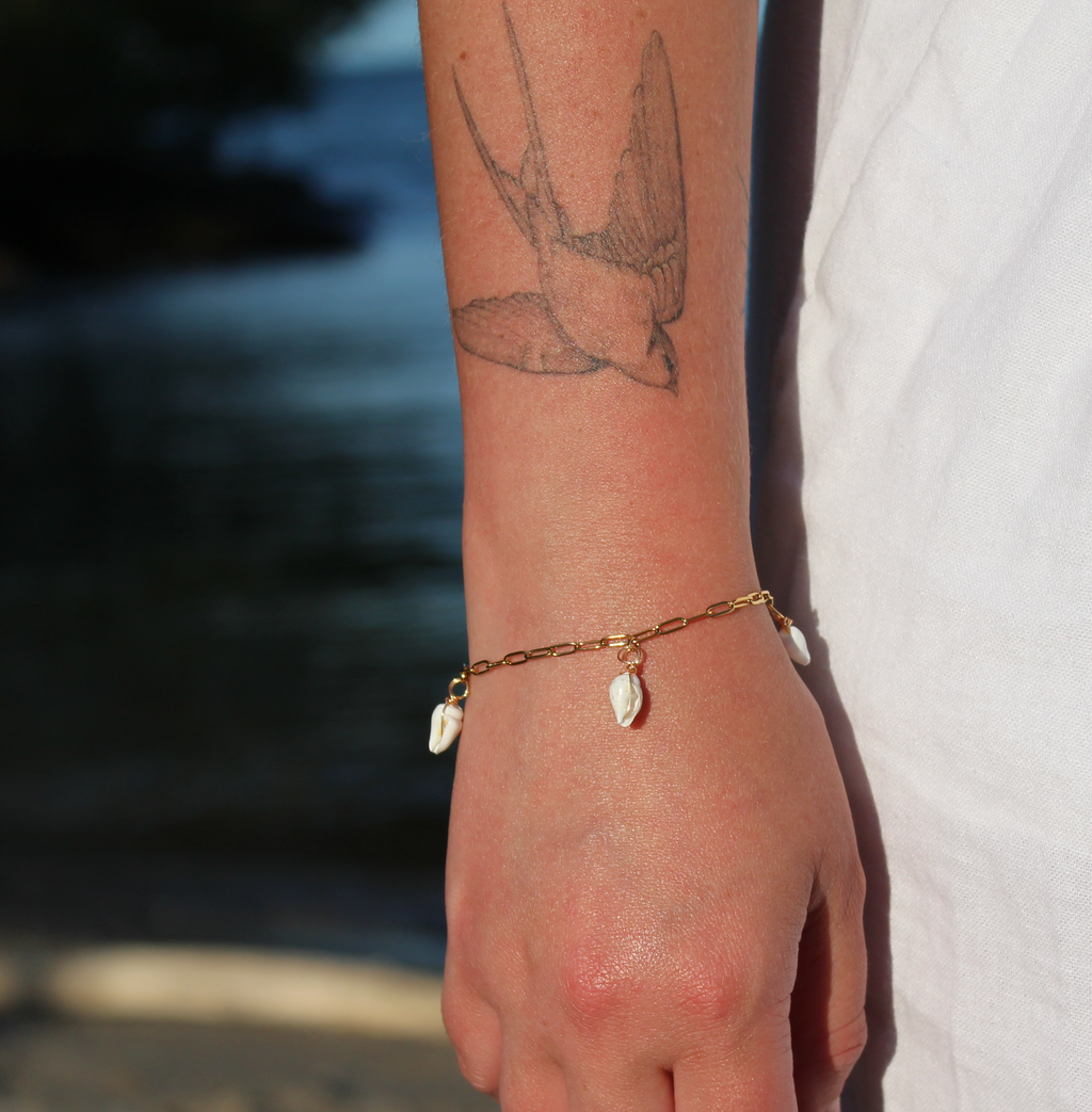18K gold-plated waterproof tarnish-free paperclip chain bracelet with 3 mini seashells, handmade and woman owned by CHRMD.