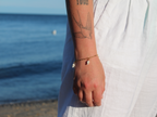 18K gold-plated waterproof tarnish-free paperclip chain bracelet with 3 mini seashells, handmade and woman owned by CHRMD.